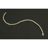 WITHDRAWN - A 9 ct gold tennis bracelet, length 18 cm,