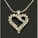 An 18 ct white gold heart shaped pendant, on chain, set with diamonds weighing +/- .52 carats.