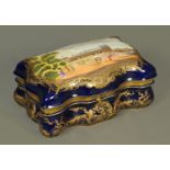 A Sevres porcelain casket, with Chateau scene, with Sevres mark. Length 33 cm (see illustration).