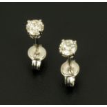 A pair of 18 ct white gold stud earrings, set with diamonds weighing +/- .50 carats.
