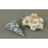 A French Faience lidded vase, and a wall pocket. Vase height 20 cm.