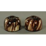 A pair of Edwardian brown and cream swirl patterned inkwells. Diameter 11.5 cm.