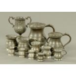 A matched set of eleven graduated pewter measures, 19th century and later, quart-quarter gill,