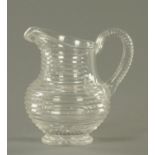 A 19th century cut glass water jug. Height 17.5 cm.