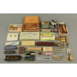 A large collection of writing accessories, including pen nibs, Faber pencils, Swan pencils,