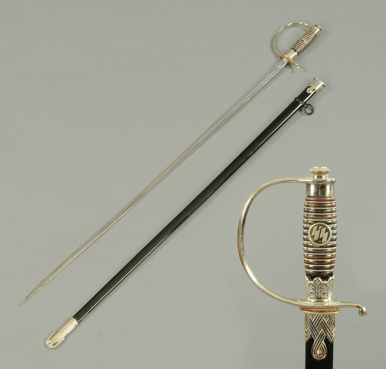 A World War Two SS Officer's dress sword, the blade by Alcoso, Solingen,