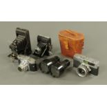 A Voigtlander Veto-B 35 mm SLR camera, in leather case, a Zeiss Ikonta bellow camera,