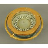 An American marine compass, early 20th century, within a brass case and gimble mount,