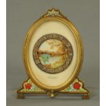 A gilt brass and Champleve enamel boudoir clock, the dial with river landscape decoration,