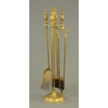 A brass companion stand, four irons.