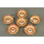 Six Paragon fine bone china cups and saucers, rose patterned and heightened with gilding.