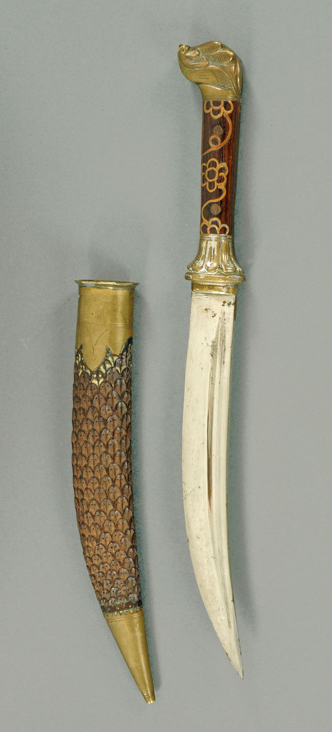 An Eastern dagger, with single fullered curved blade,