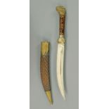 An Eastern dagger, with single fullered curved blade,