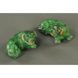 A pair of Chinese incense stick holders, 19th century, modelled as recumbent shi-shi,