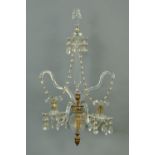 A Regency cut glass two branch wall mounting candle holder. Height +/- 60 cm (see illustration).