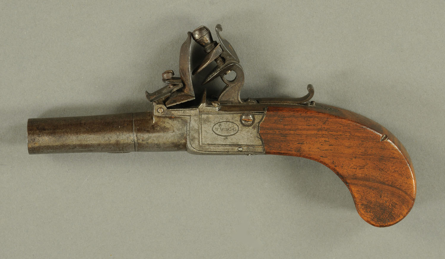 A flintlock pocket pistol, late 18th century, engraved "Twigg, London",