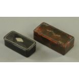 Two 19th century papier-mache snuffboxes. Largest length 82 mm.