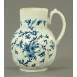 A late 18th century Worcester blue and white jug, cabbage leaf moulded and with floral pattern.