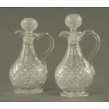 A pair of 19th century hob cut glass jug decanters. Height 28 cm.