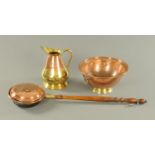 A copper and brass water jug, Eastern copper bowl with brass foot and ring handles,