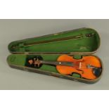 A three quarter size violin, early 20th century, with two piece back and in fitted case with bow.