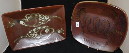 A Winchcombe Pottery rounded rectangular dish, slip decorated with Ox bow river design,