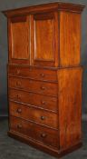 A 19th Century mahogany linen press chest with ogee moulded pediment,