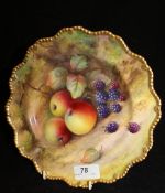 A Royal Worcester cabinet plate with gilt-lined shaped rim,