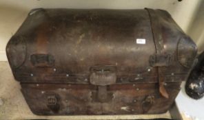 A brown leather trunk,