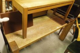 A rectangular oak dining table and two two-seater oak benches