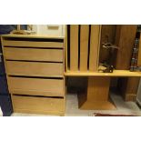 A collection of furniture comprising a modern oak corner cupboard with two doors enclosing DVD and