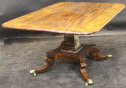 A 19th Century mahogany and rosewood cross banded breakfast table with tilt top to square central