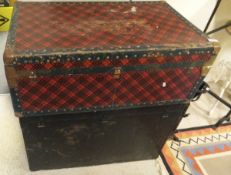 An iron bound steamer trunk painted black,