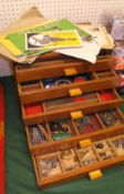 A wooden five drawer chest containing a quantity of various vintage Meccano,