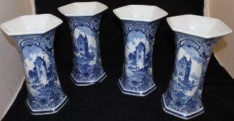 A set of four modern Delft hexagonal blue and white vases