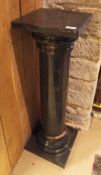 A black marble and coloured marble column urn stand in the classical taste