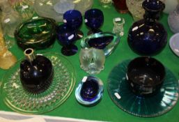 A collection of glassware to include an amethyst finger bowl, a studio glass green bowl,