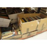 A large quantity of assorted books to include fiction, titles relating to antiques,