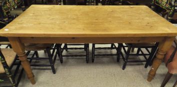 A rectangular pine table on four turned legs