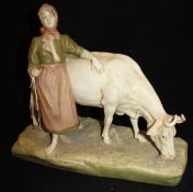 A Royal Dux figure group of woman and cow, bears pink triangle mark to base, No'd.