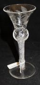 A 19th Century air twist glass of thistle form with engraved decoration of a rose (possibly