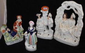 A collection of four 19th Century Staffordshire figure groups including "Dog tray" depicting girl