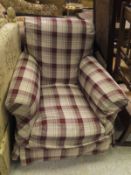 A 19th Century armchair with loose checked covers and square section mahogany tapering legs to