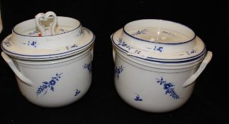 A pair of 19th Century French blue and white floral spray decorated ice pails with dished tops,