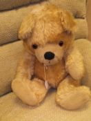 A German (probably) gold plush bear with growler,