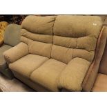 A two seater sofa in oatmeal upholstery together with a mint green pull-out bed/armchair