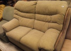 A two seater sofa in oatmeal upholstery together with a mint green pull-out bed/armchair