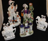 A Victorian Staffordshire figure group of hunter with rabbits and dog,