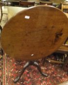 A 19th Century mahogany tilt-top table,