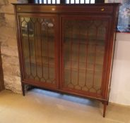 An Edwardian mahogany and satinwood banded display cabinet in the Sheraton revival taste,